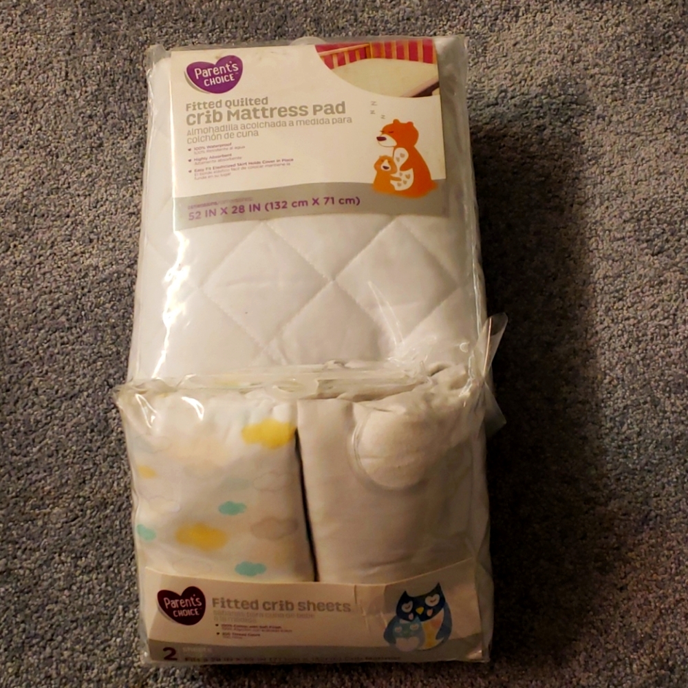 Crib sheets and mattress pad.